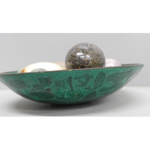 2029 - A collection of egg shaped mineral samples in a malachite bowl