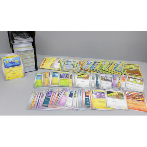 2032 - A collection of over 600 Pokémon cards in collectors box with some holographic