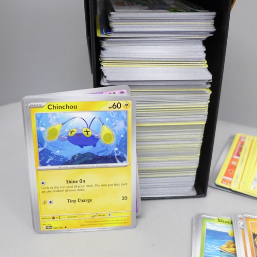 2032 - A collection of over 600 Pokémon cards in collectors box with some holographic