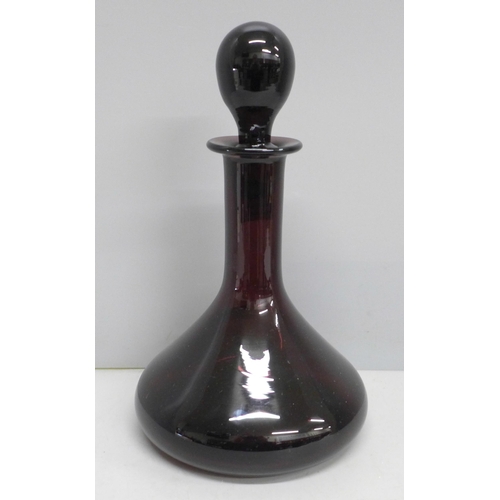 2038 - A Thomas Webb plum coloured glass decanter, 23cm