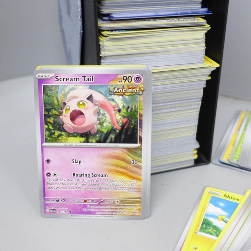 2041 - A collection of over 600 Pokémon cards in collectors box with some holographic