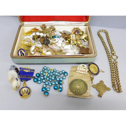 2046 - A jewellery box containing costume jewellery, badges, medallions and coins