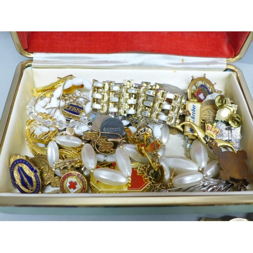 2046 - A jewellery box containing costume jewellery, badges, medallions and coins