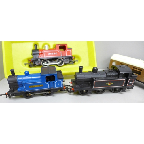 2051 - A collection of Hornby model rail including two locomotives, three carriages and wagons, also two ot... 