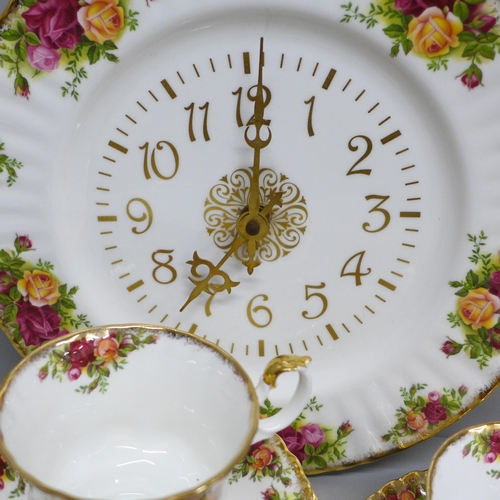 2061 - Six Royal Albert Old Country Roses cups, saucers and tea plates, a cream and sugar and a clock