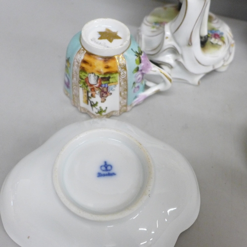 2086 - A pair of early 20th Century German porcelain figures and two Dresden cups and saucers, (fingers on ... 