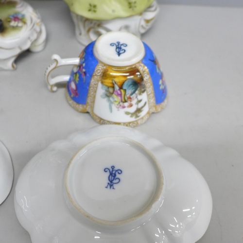 2086 - A pair of early 20th Century German porcelain figures and two Dresden cups and saucers, (fingers on ... 