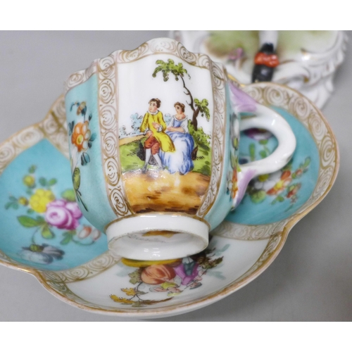 2086 - A pair of early 20th Century German porcelain figures and two Dresden cups and saucers, (fingers on ... 