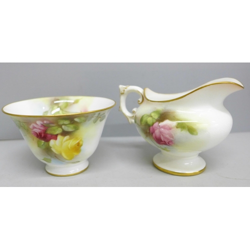 2091 - A Royal Worcester cream and sugar, decorated with roses, a Coalport vase and cover, green ground bas... 