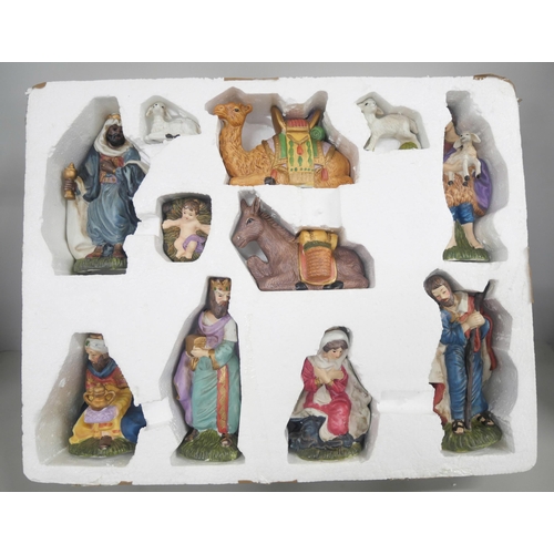 2132 - A vintage porcelain Nativity set with 11 piece hand painted porcelain. In original box.