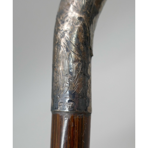 2189 - A silver topped parasol handle