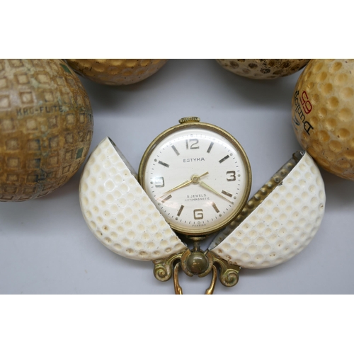 2196 - A German novelty pendant fob watch in the form of a golf ball and five early golf balls