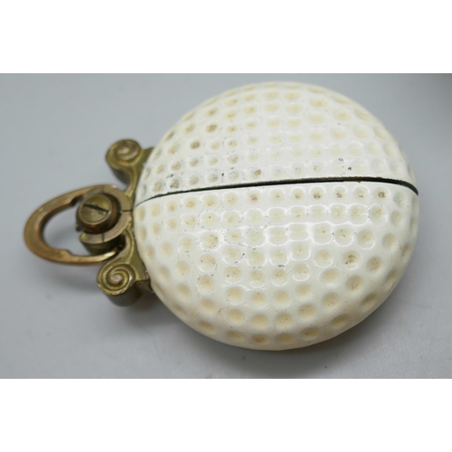 2196 - A German novelty pendant fob watch in the form of a golf ball and five early golf balls