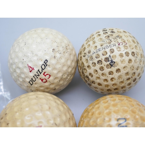 2196 - A German novelty pendant fob watch in the form of a golf ball and five early golf balls