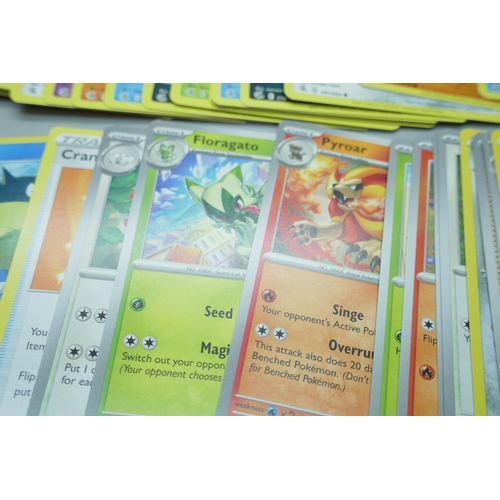 2208 - A collection of over 600 Pokémon cards in collectors box with some holographic