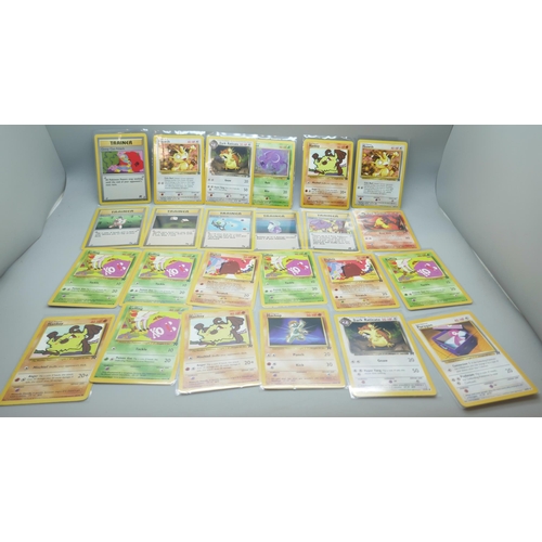 2213 - Thirty-six vintage Pokémon cards in protective sleeves, mostly Team Rocket