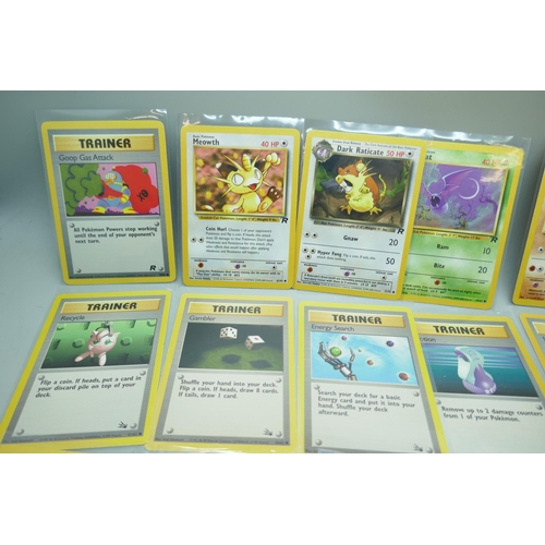 2213 - Thirty-six vintage Pokémon cards in protective sleeves, mostly Team Rocket