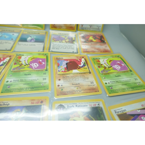 2213 - Thirty-six vintage Pokémon cards in protective sleeves, mostly Team Rocket