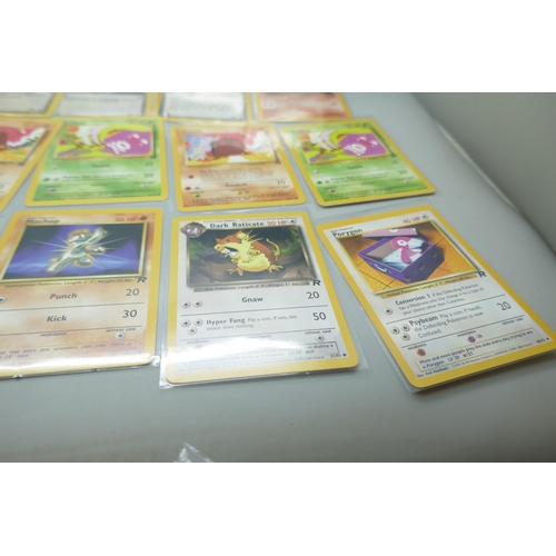 2213 - Thirty-six vintage Pokémon cards in protective sleeves, mostly Team Rocket