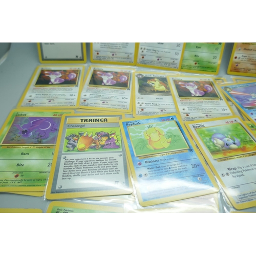 2213 - Thirty-six vintage Pokémon cards in protective sleeves, mostly Team Rocket