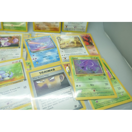 2213 - Thirty-six vintage Pokémon cards in protective sleeves, mostly Team Rocket