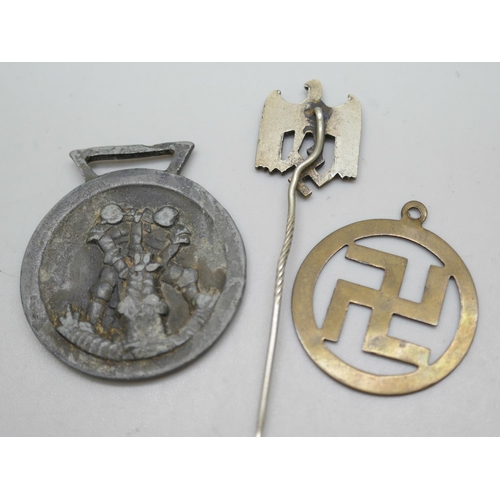 2218 - A German Third Reich medal, a similar pin and a good luck charm