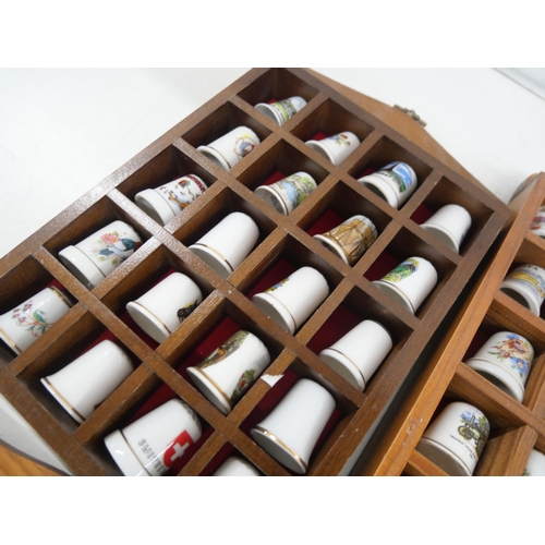 A large collection of thimbles with three display racks **PLEASE NOTE ...