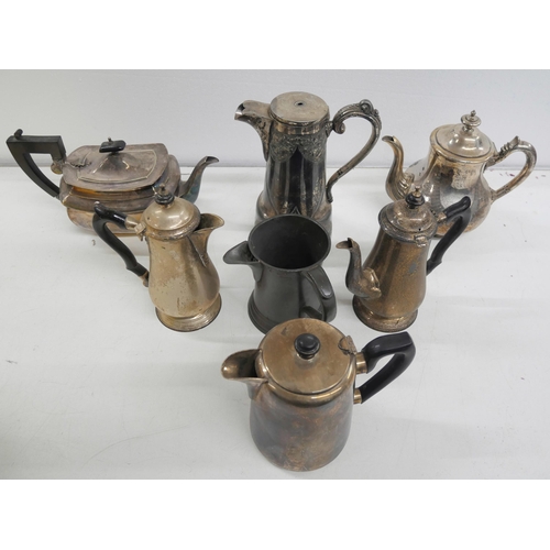 2323 - A collection of silver plate including teapots, jugs, lidded tureen with cow finial, pots/cups, etc.... 