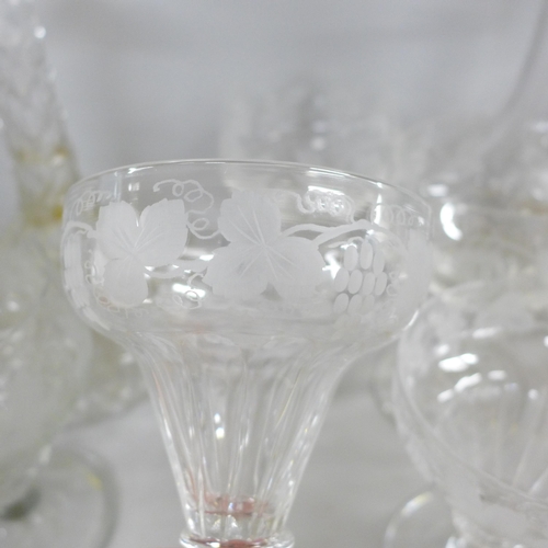 2333 - Glass; a set of six 19th century grape and vine wine glasses, five champagne glasses and a pair of d... 