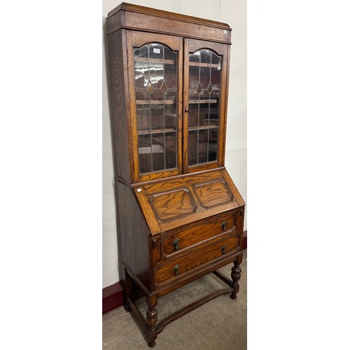 110 - An early 20th Century oak bureau bookcase