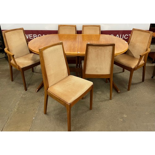 35 - A Nathan teak oval extending dining table and six chairs