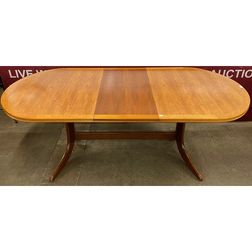 35 - A Nathan teak oval extending dining table and six chairs