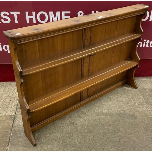 49 - An Ercol Golden Dawn ash plate rack