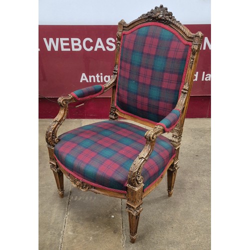 69 - A pair of French Louis XV style carved walnut and fabric upholstered fauteuil chairs