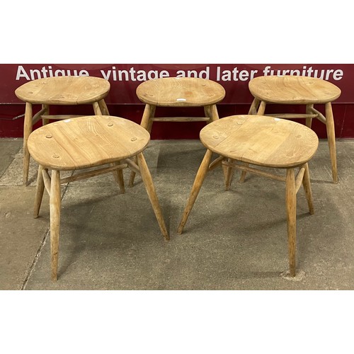 52 - A set of five Ercol Blonde elm and beech stools