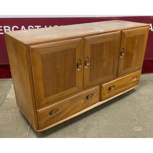 57 - An Ercol Blonde elm Windsor sideboard