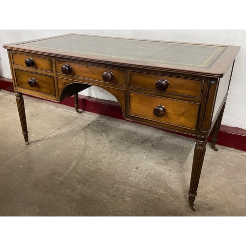 62 - A George IV oak and green leather topped library desk