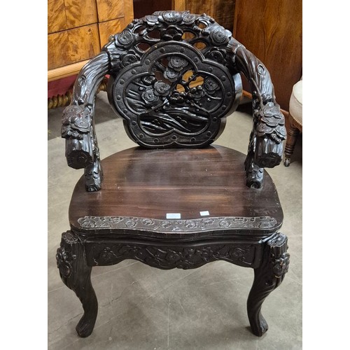 73 - A Chinese carved hardwood open armchair