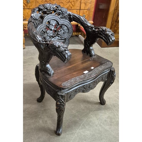 73 - A Chinese carved hardwood open armchair