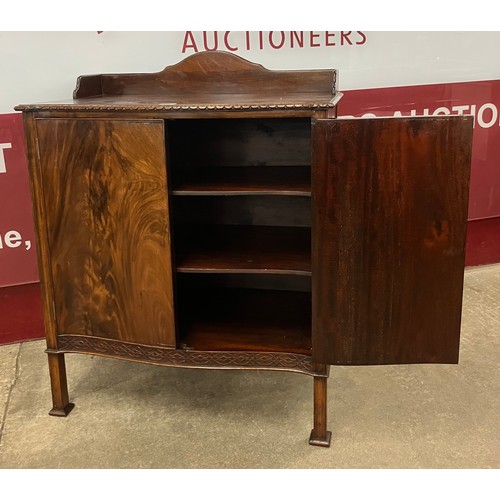 156 - An Edward VII Chippendale Revival mahogany serpentine two door side cabinet