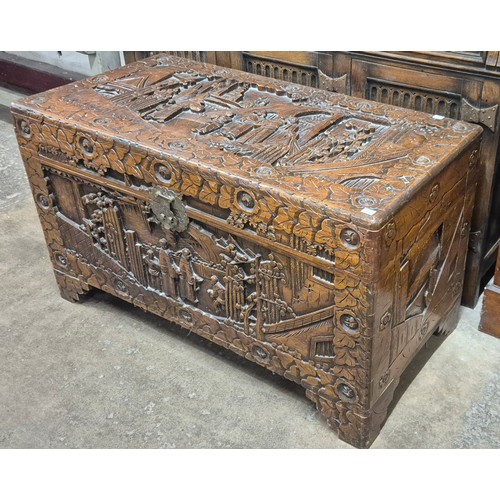 73B - A Chinese carved camphorwood blanket box