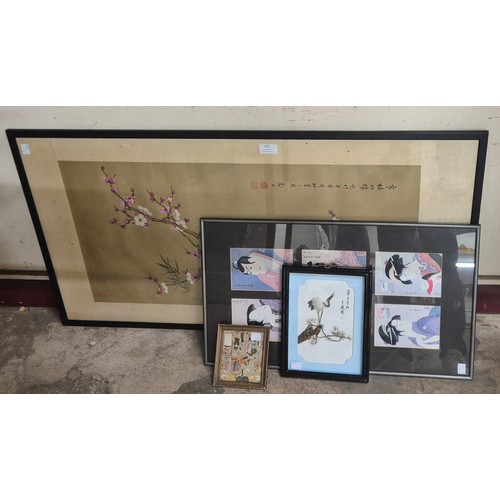 375 - A Chinese painting on silk, two Japanese prints and a crane relief plaque