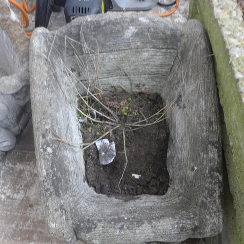 5195 - A concrete wheelbarrow planter and a concrete fox design planter and one other rectangular concrete ... 