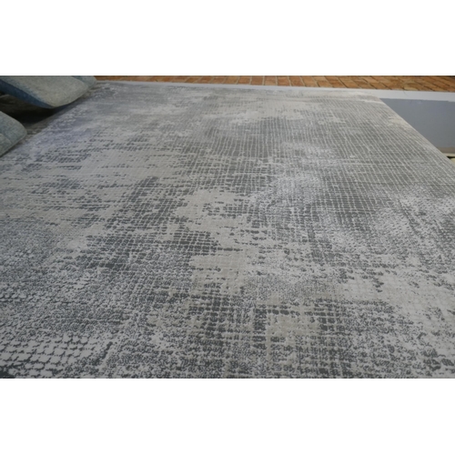 A contemporary patterned grey ground rug, 300cm x 200cm