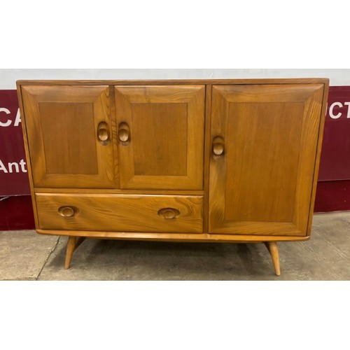 17 - An Ercol Blonde elm and beech Windsor sideboard