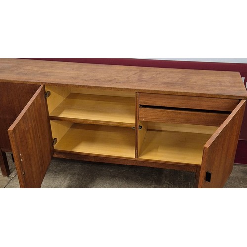 21 - A teak sideboard