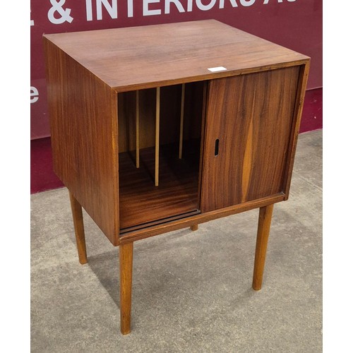 22 - A teak two door record cabinet