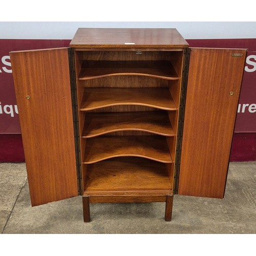 24 - A teak fitted two door record cabinet