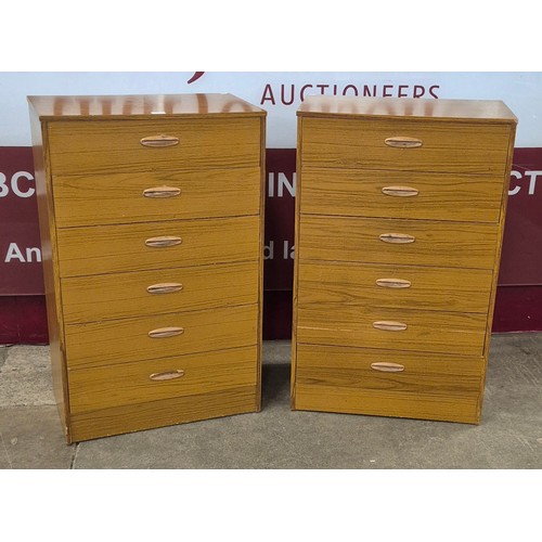 63 - A pair of simulated teak chests of drawers