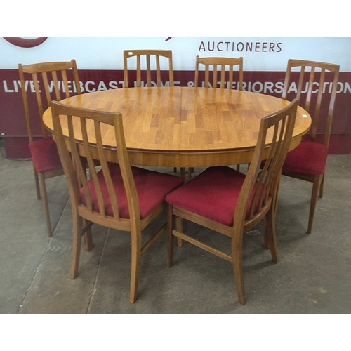 66 - A William Lawrence teak oval extending dining table and six chairs